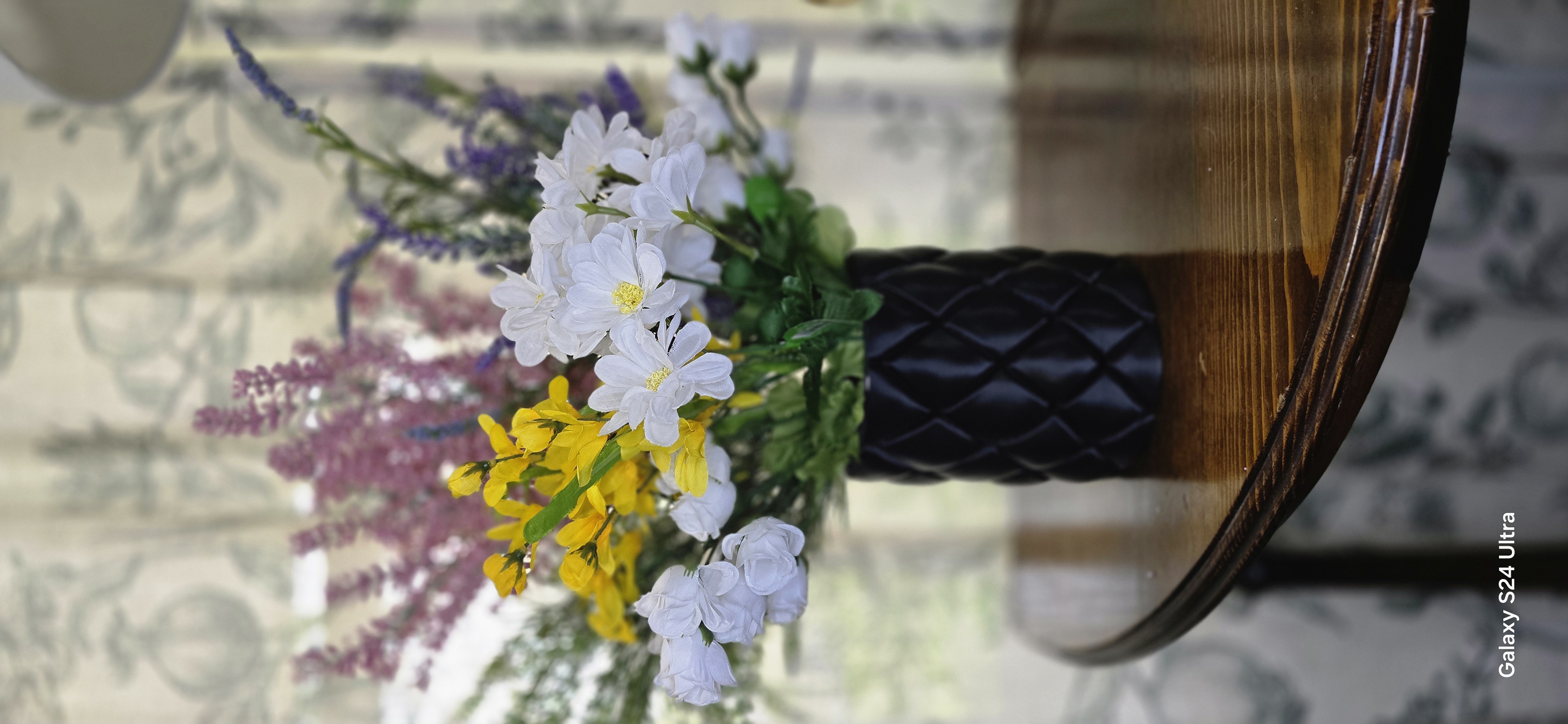 Black diamond vase with colorful mixed flowers